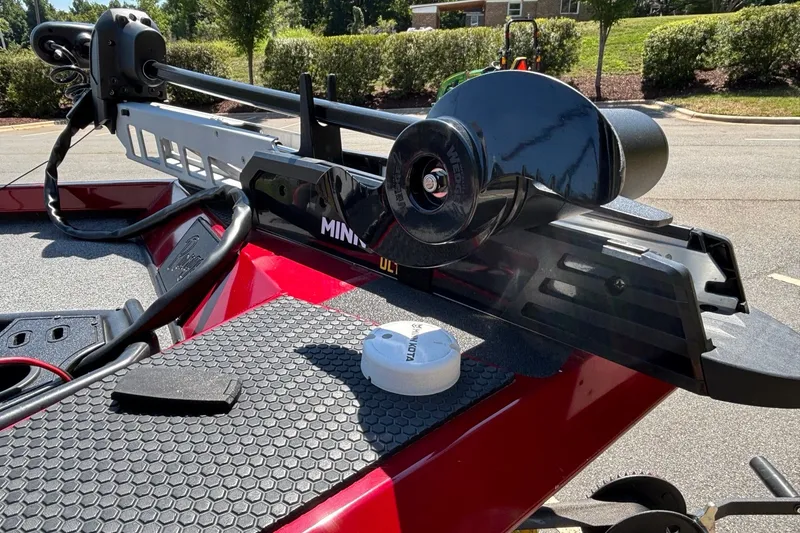 Slide: The Image of 2024 Ranger RT188 boat with Minn Kota trolling motor on red deck. - 14