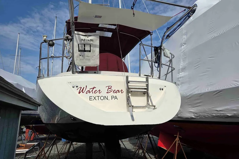 Slide: The Image of 1990 Canadian Sailcraft 34 sailboat named "Water Bear" in Exton, PA, docked on land. - 24