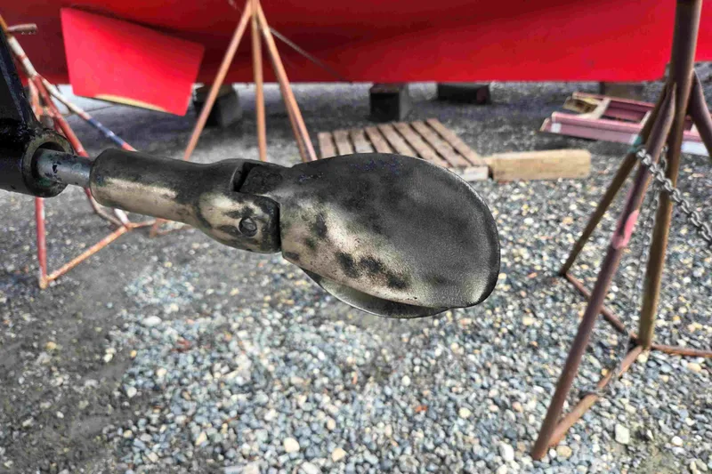 Slide: The Image of Propeller of a 1990 Canadian Sailcraft 34 sailboat on a gravel surface. - 25