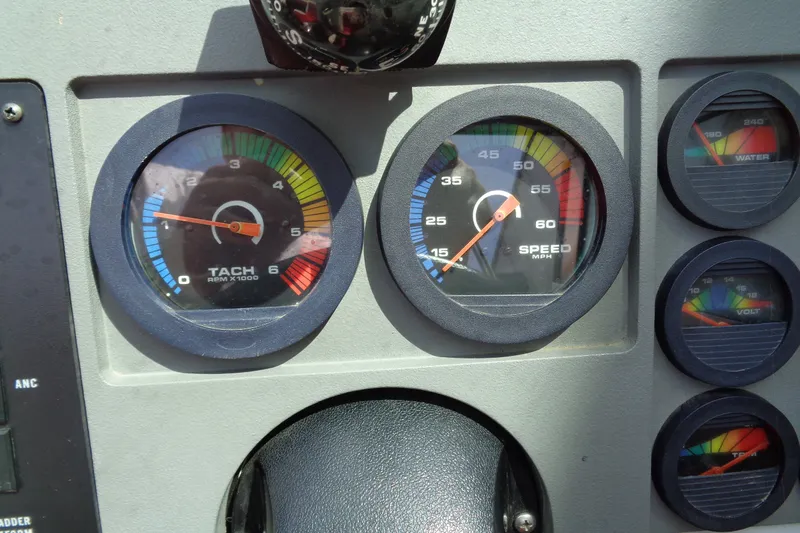 Slide: The Image of Dashboard of a 1989 Stingray 172 SC boat with tachometer and speedometer gauges. - 22