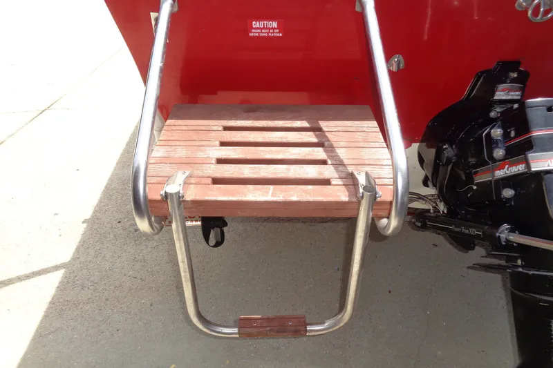Slide: The Image of Wooden swim platform with metal ladder on 1989 Stingray 172 SC boat. - 8