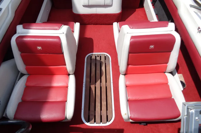 Slide: The Image of Red and white interior seats of a 1989 Stingray 172 SC boat. - 17
