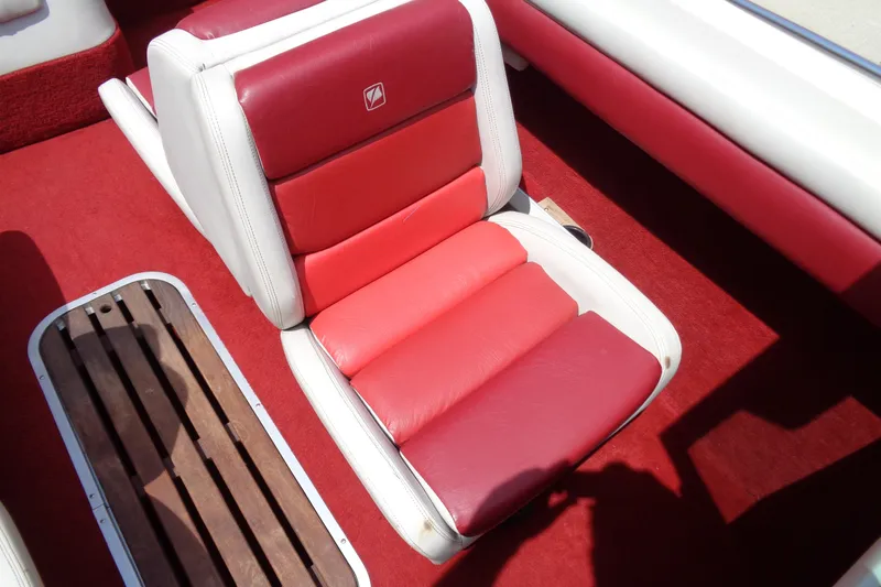 Slide: The Image of Red and white seating in a 1989 Stingray 172 SC boat interior. - 19
