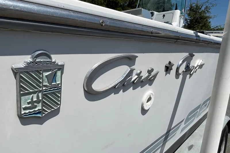 Slide: The Image of 1989 Chris-Craft 213 Sea Hawk boat with emblem and logo detail. - 19