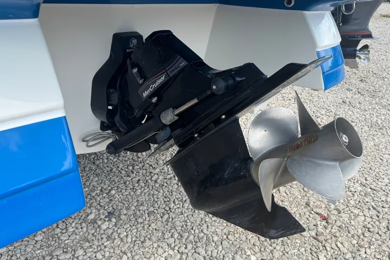 Slide: The Image of 2009 Rinker 248 Captiva Deckboat with MerCruiser Bravo Three outdrive on gravel. - 20