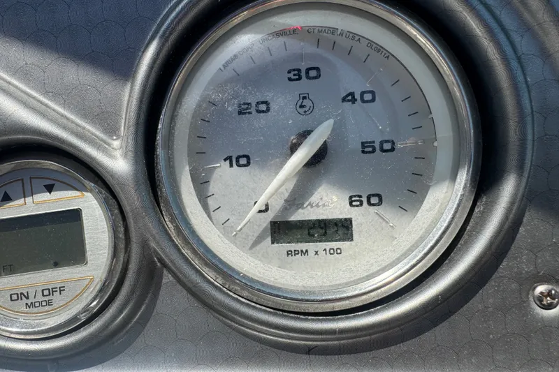 Slide: The Image of Close-up of 2009 Rinker 248 Captiva Deckboat tachometer showing RPM and digital display. - 9