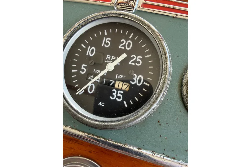 Slide: The Image of 1974 Willard Vega Voyager RPM gauge displaying hours and revolutions. - 24