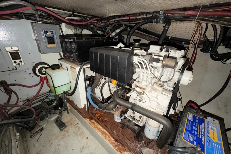 Slide: The Image of Engine room of a 1974 Willard/Vega Voyager with marine generator and wiring. - 28