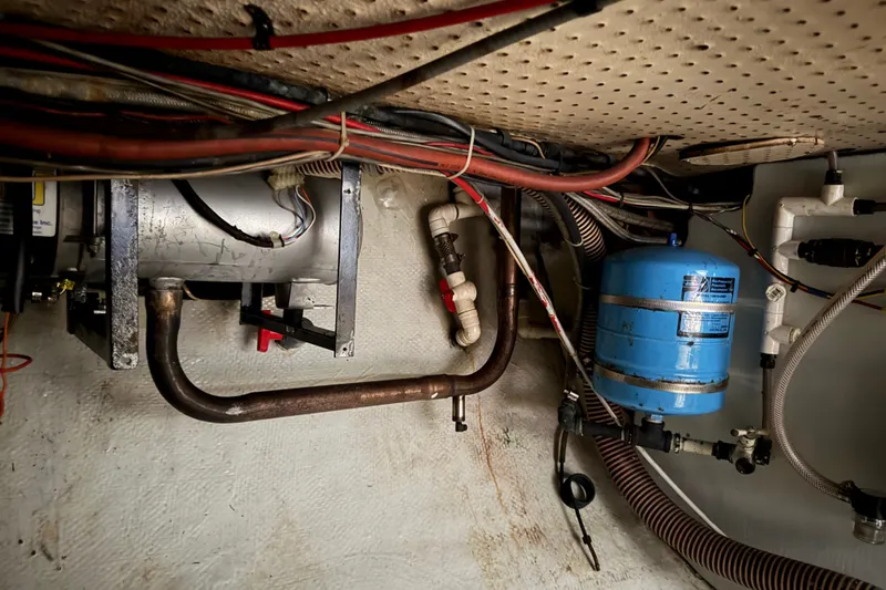Slide: The Image of 1974 Willard Vega Voyager engine compartment with wiring and blue pressure tank. - 30