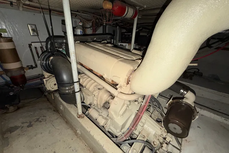 Slide: The Image of Engine room of a 1974 Willard Vega Voyager boat, showcasing mechanical components. - 27