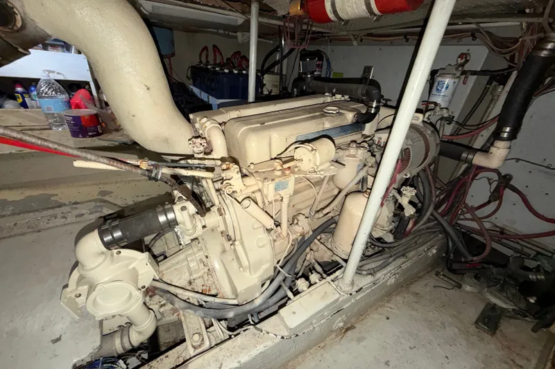 Slide: The Image of 1974 Willard/Vega Voyager engine room with visible machinery and wiring. - 26