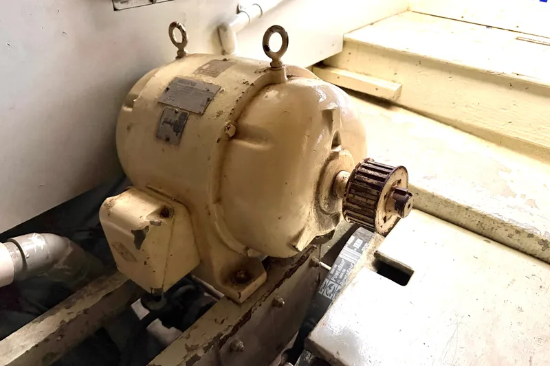 Slide: The Image of 1974 Willard Vega Voyager engine component in a boat's mechanical area. - 29