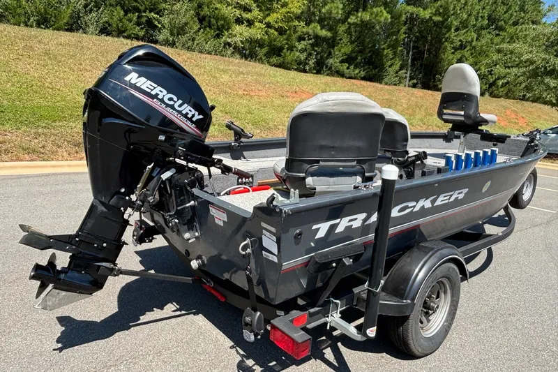 Slide: The Image of 2020 Tracker Guide V-16 Laker Deep V boat with Mercury outboard motor on trailer. - 14