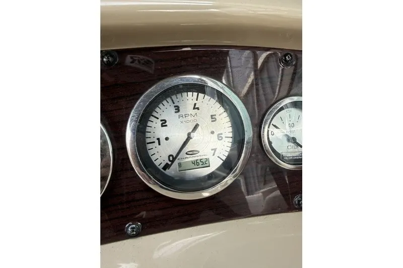 Slide: The Image of Dashboard of 2003 Chaparral 265 SSi boat showing RPM and oil gauges. - 17