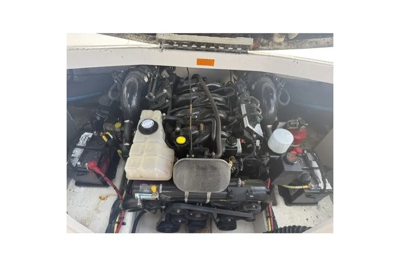 Slide: The Image of Engine compartment of a 2003 Chaparral 265 SSi boat, showcasing mechanical components. - 16