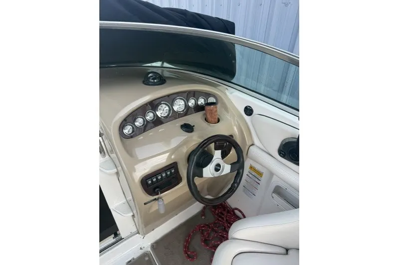 Slide: The Image of 2003 Chaparral 265 SSi boat dashboard with steering wheel and instrument panel. - 10