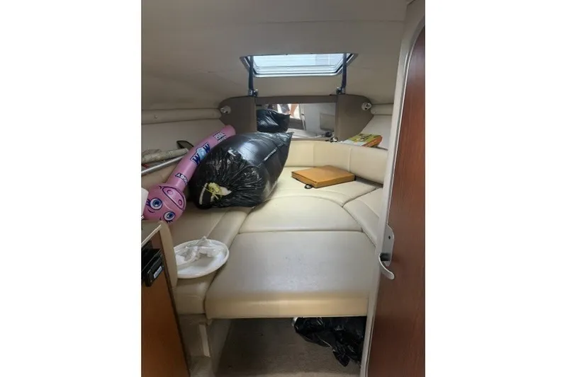 Slide: The Image of Interior of 2003 Chaparral 265 SSi boat with seating and storage items. - 8