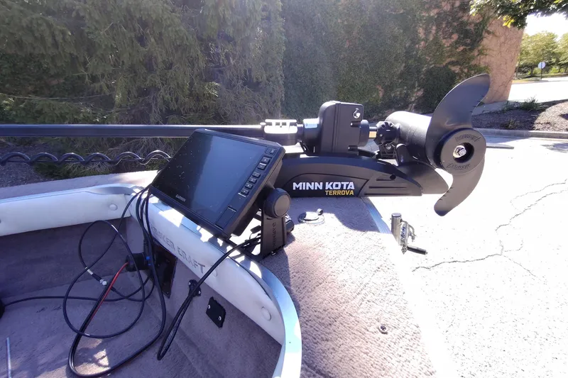 Slide: The Image of 1996 Smoker Craft Phantom 16 with Minn Kota Terrova trolling motor and Garmin fishfinder. - 15