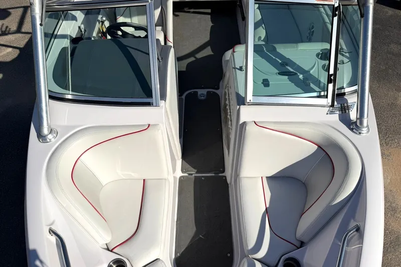 Slide: The Image of 2008 Correct Craft Super Air Nautique 210 boat interior with white seating and red accents. - 40