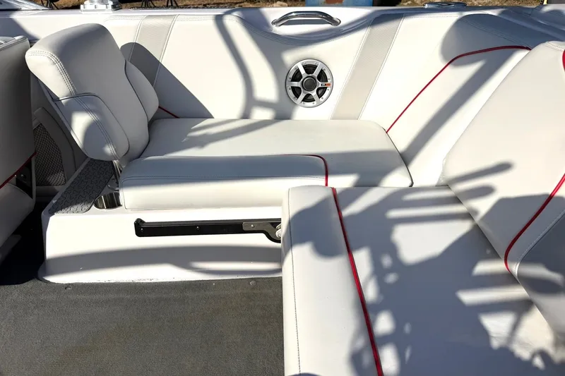 Slide: The Image of Interior of 2008 Correct Craft Super Air Nautique 210 with white seating and red accents. - 27