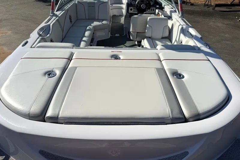 Slide: The Image of 2008 Correct Craft Super Air Nautique 210 boat interior with white and gray seating. - 21