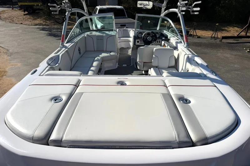 Slide: The Image of 2008 Correct Craft Super Air Nautique 210 boat interior with white seating and open cockpit. - 22