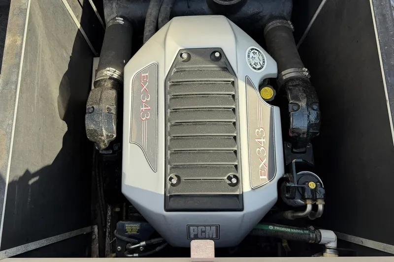 Slide: The Image of 2008 Correct Craft Super Air Nautique 210 engine, PCM EX343 model, in a boat compartment. - 37