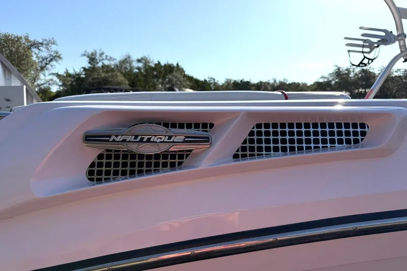 Slide: The Image of 2008 Correct Craft Super Air Nautique 210 boat detail with Nautique logo and grille. - 46