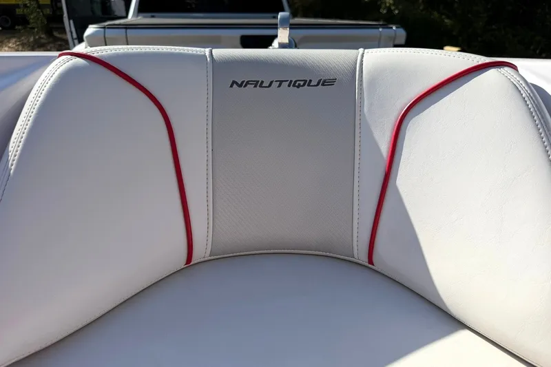 Slide: The Image of 2008 Correct Craft Super Air Nautique 210 boat seat with red accents and logo. - 39