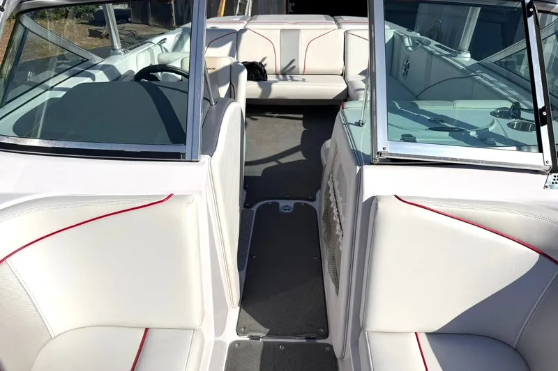Slide: The Image of 2008 Correct Craft Super Air Nautique 210 interior with white seating and red accents. - 4
