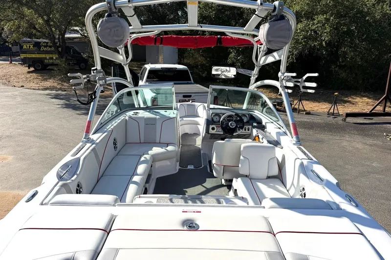 Slide: The Image of 2008 Correct Craft Super Air Nautique 210 boat interior with white seating and wakeboard tower. - 3