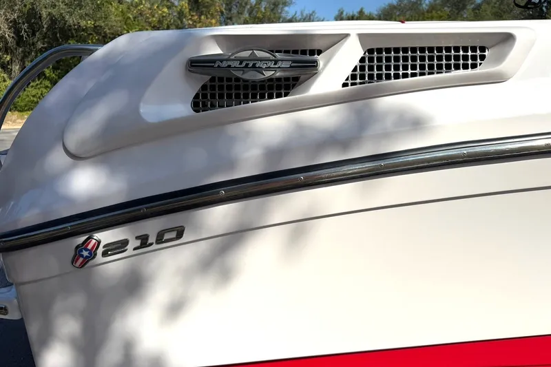 Slide: The Image of 2008 Correct Craft Super Air Nautique 210 boat detail with logo and model number. - 45