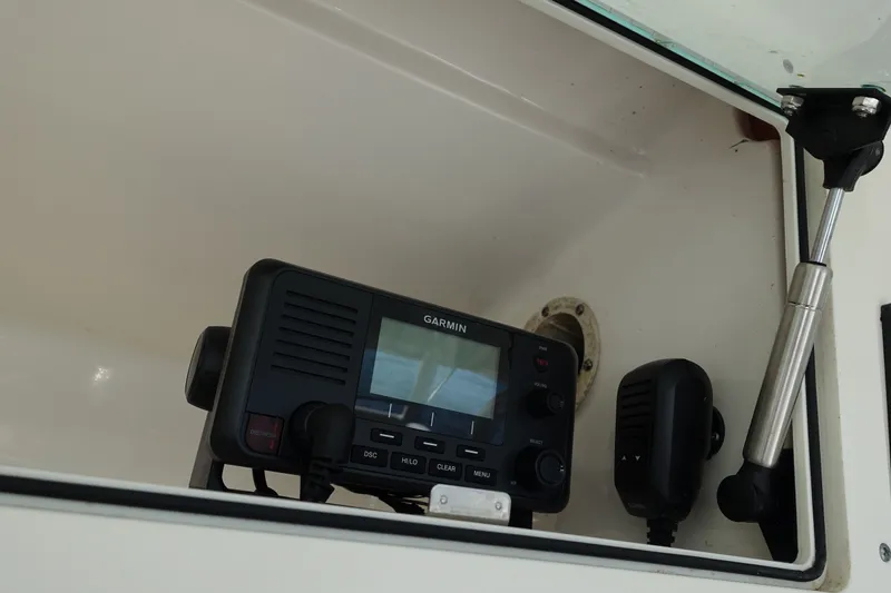 Slide: The Image of Garmin marine radio inside 2017 Robalo R305 Walkaround boat compartment. - 25