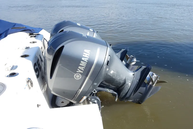 Slide: The Image of 2017 Robalo R305 Walkaround with twin Yamaha outboard motors on water. - 16