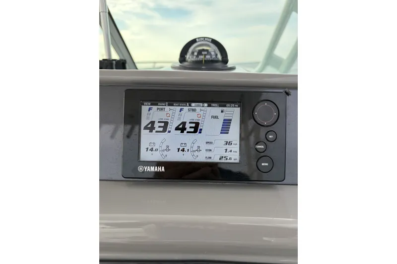 Slide: The Image of Yamaha display on 2017 Robalo R305 Walkaround boat dashboard, showing engine and fuel stats. - 21