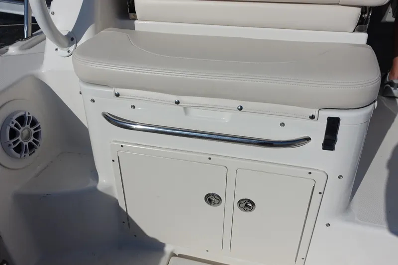 Slide: The Image of 2017 Robalo R305 Walkaround boat seat with storage and speaker. - 27