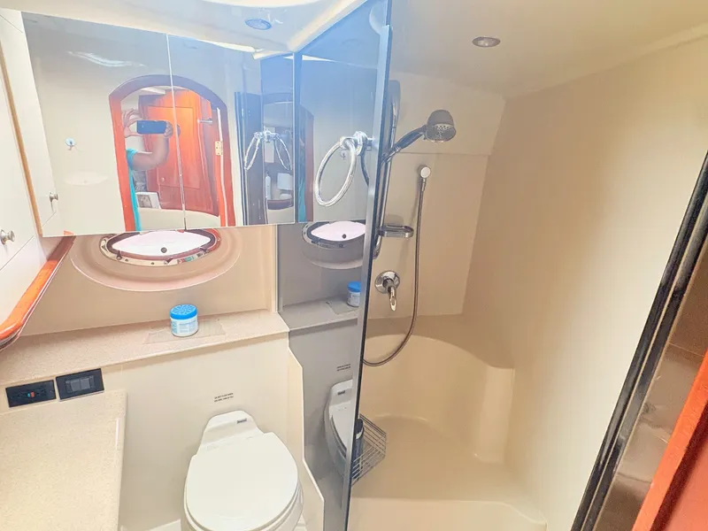 Slide: The Image of The image shows the bathroom of a 2007 Cruisers 37O Express with a shower and toilet. - 29