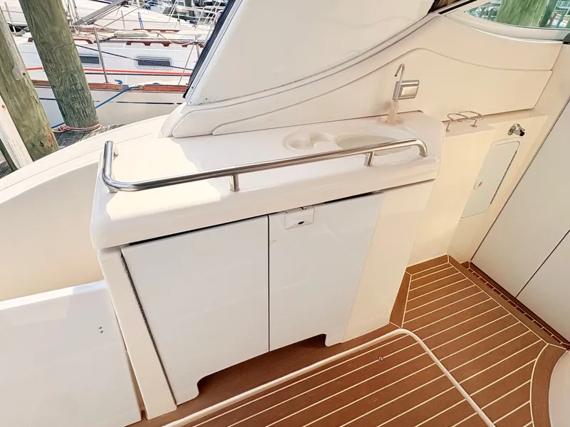 Slide: The Image of The 2007 Cruisers 37O Express features a sleek outdoor kitchenette with a sink and storage. - 12