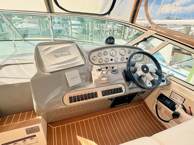 Slide: The Image of The 2007 Cruisers 37O Express cockpit features a modern dashboard with Garmin navigation. - 17