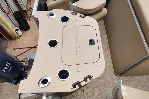 Slide: The Image of 2018 Bennington SSX21 boat deck with cup holders and measuring guide. - 9