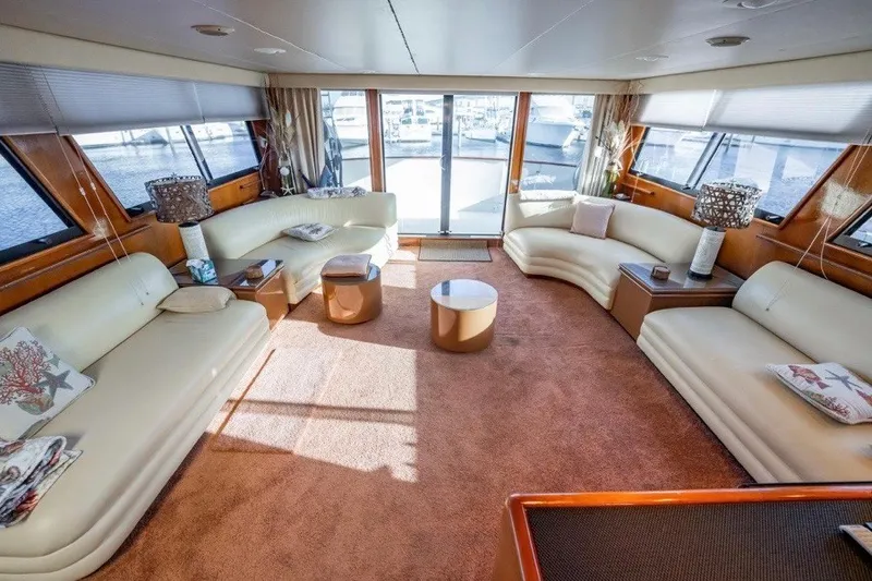 Slide: The Image of Luxurious interior of 1989 Viking 63 Motor Yacht with plush seating and elegant decor. - 15