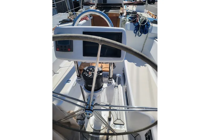 Slide: The Image of Steering wheel and navigation equipment on a 2002 Tartan 3700 sailboat. - 27