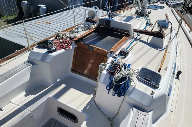 Slide: The Image of Cockpit of 2002 Tartan 3700 sailboat with ropes and winches visible. - 29
