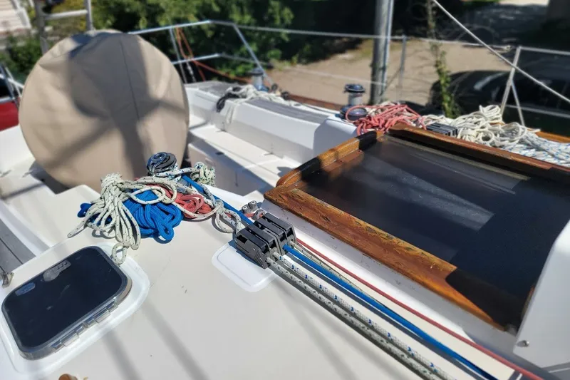 Slide: The Image of Deck of 2002 Tartan 3700 sailboat with ropes and hatch. - 26