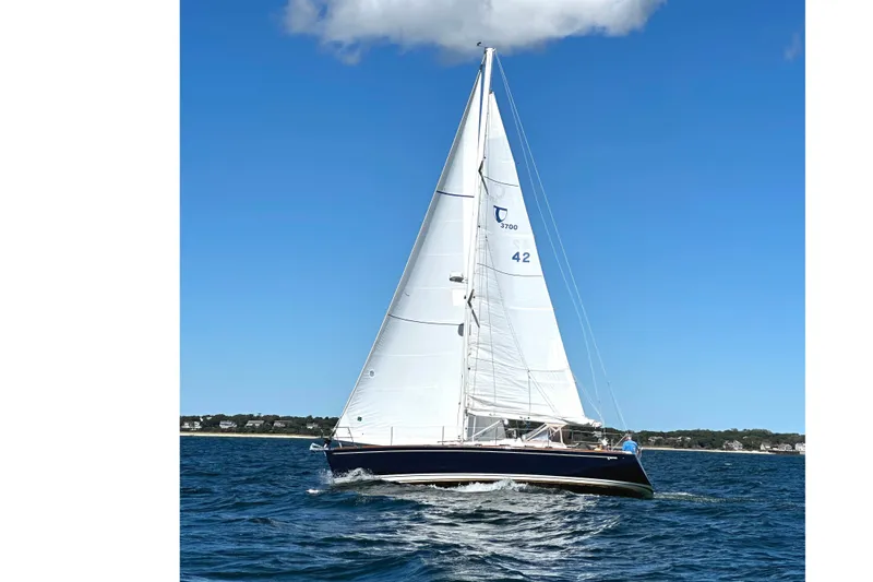 Slide: The Image of Sailing yacht Tartan 3700, 2002 model, gliding on blue ocean under clear sky. - 34