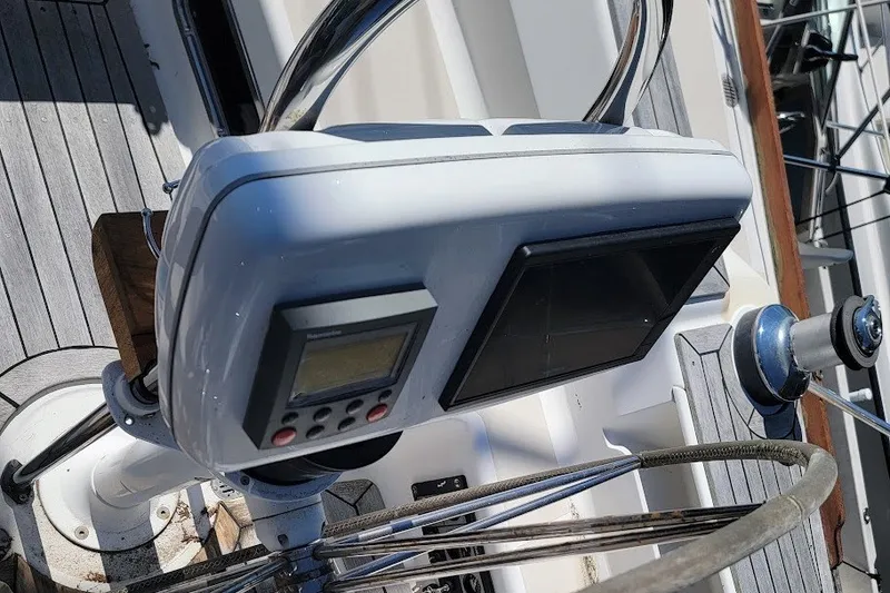 Slide: The Image of Steering console of a 2002 Tartan 3700 sailboat with navigation instruments. - 28