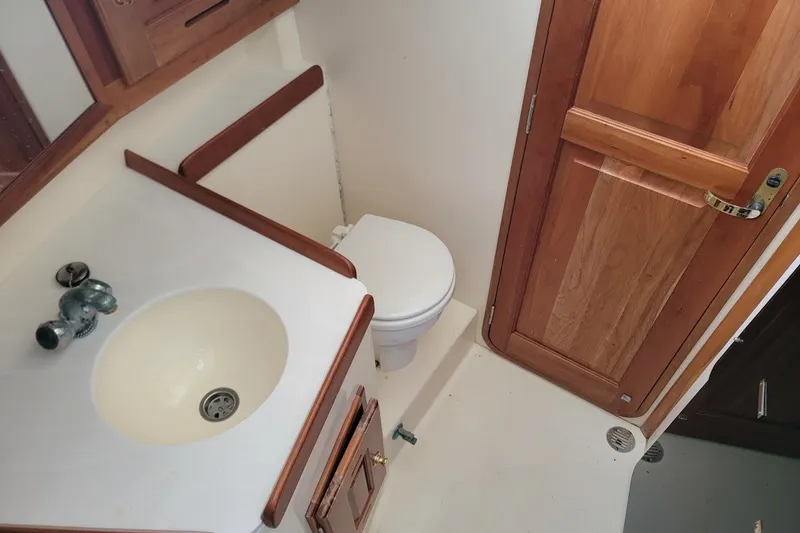 Slide: The Image of Bathroom interior of 2002 Tartan 3700 yacht with sink and toilet. - 18