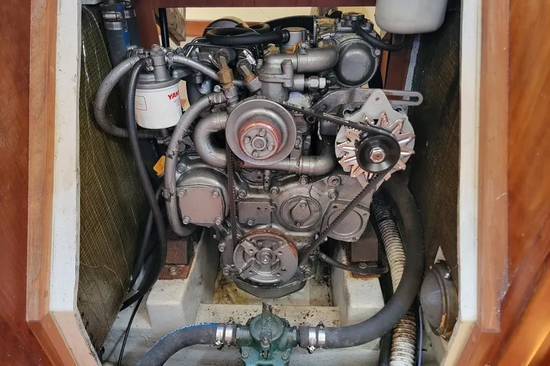 Slide: The Image of Engine compartment of a 2002 Tartan 3700 sailboat, featuring a Yanmar engine. - 11