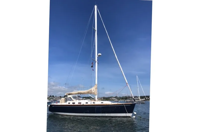Slide: The Image of Sailboat on water, 2002 Tartan 3700 model, clear blue sky background. - 38