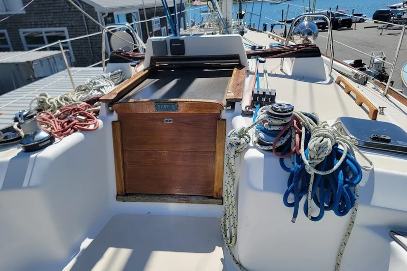 Slide: The Image of Cockpit of a 2002 Tartan 3700 sailboat with ropes and winches. - 3